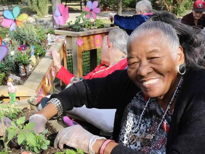 Resident planing flowers in the planters