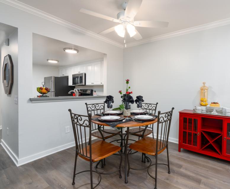 Apartment dining area with a red hutch