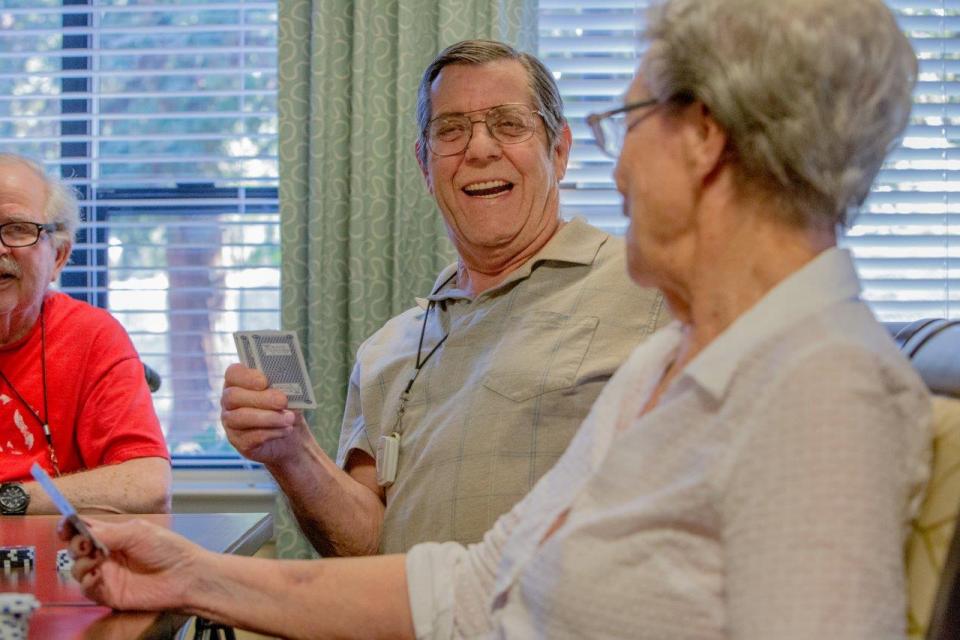 A group of residents playing cards