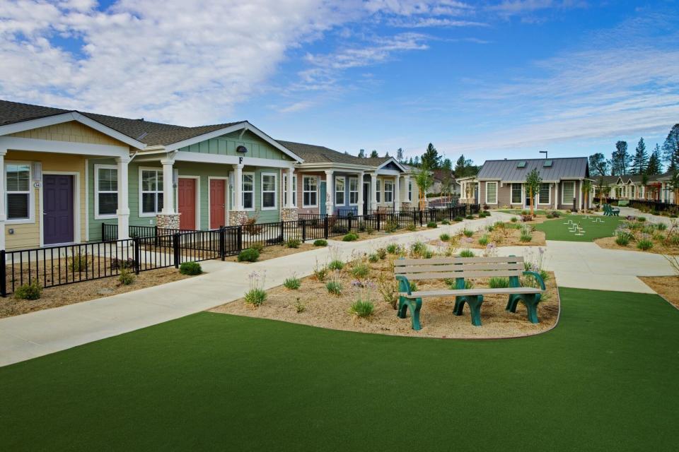 Village Placerville cottages and community outdoor area with benches