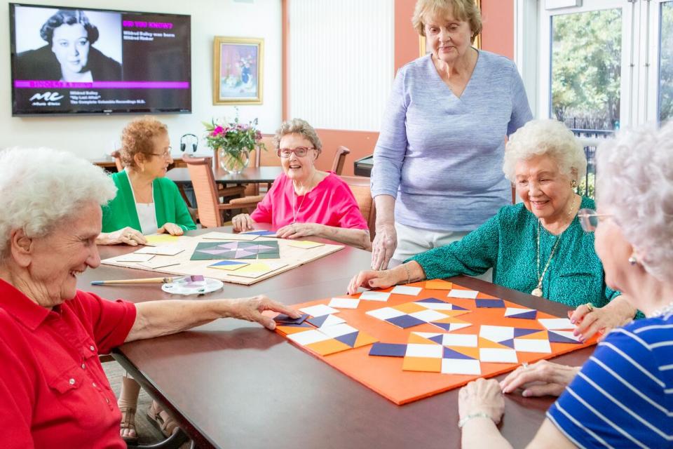 Six women at a quilting class