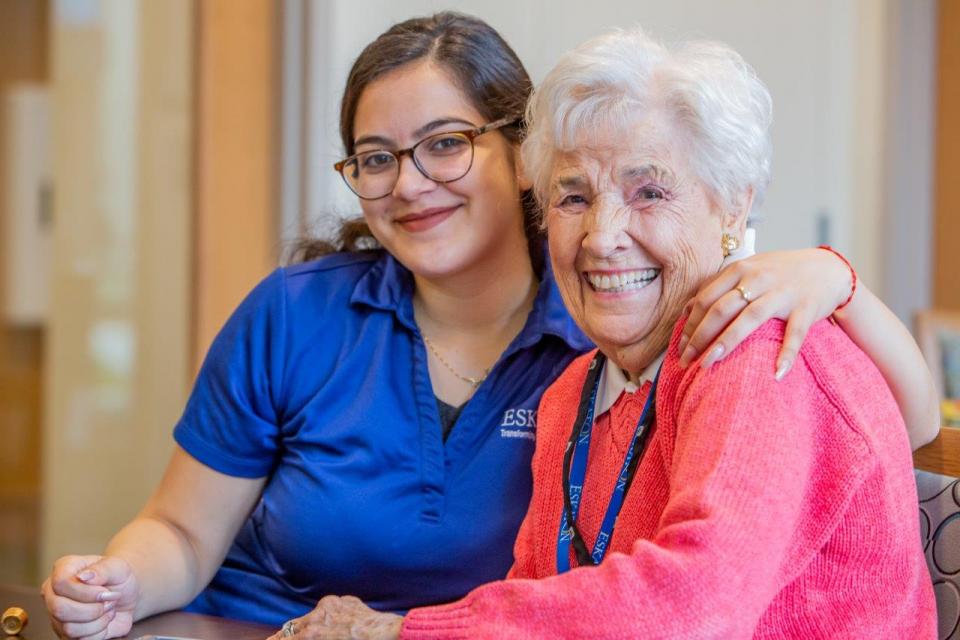 Smiling resident and staff